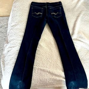 Dark denim 7 jeans with beads and crystals on pocket. It’s a beautiful jean.